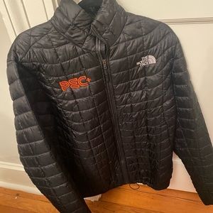 Size Medium North Face puffy jacket with brand logos